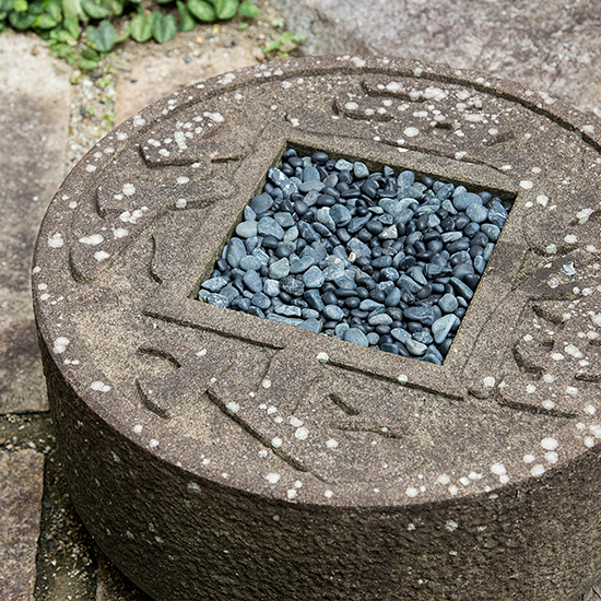 Tsukubai is wash basin in traditional Japanese garden.